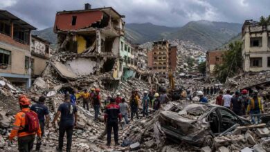 Rescue workers searching damaged buildings after a powerful earthquake in Venezuela