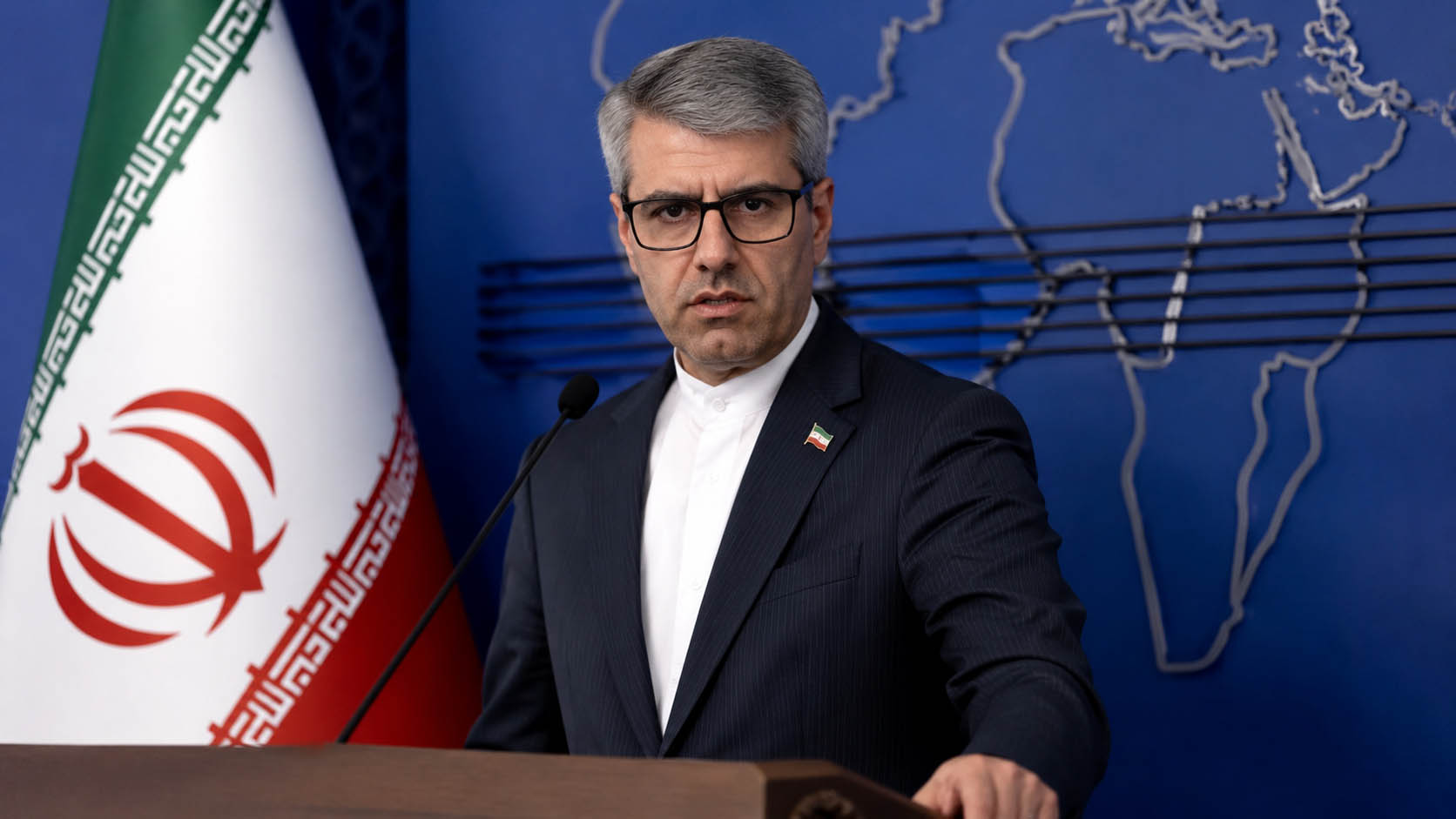 Iranian Foreign Ministry spokesperson Esmail Baghai addressing the media while discussing Iran-US diplomatic contacts.
