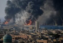 Smoke rising after reported explosions in southern Iran as emergency responders monitor the affected area.