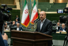 Iranian Parliament Speaker Mohammad Baqir Qalibaf delivering a speech while calling for national unity and strengthening Iran's future.