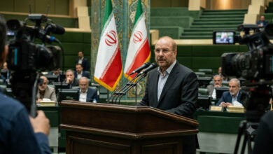 Iranian Parliament Speaker Mohammad Baqir Qalibaf delivering a speech while calling for national unity and strengthening Iran's future.